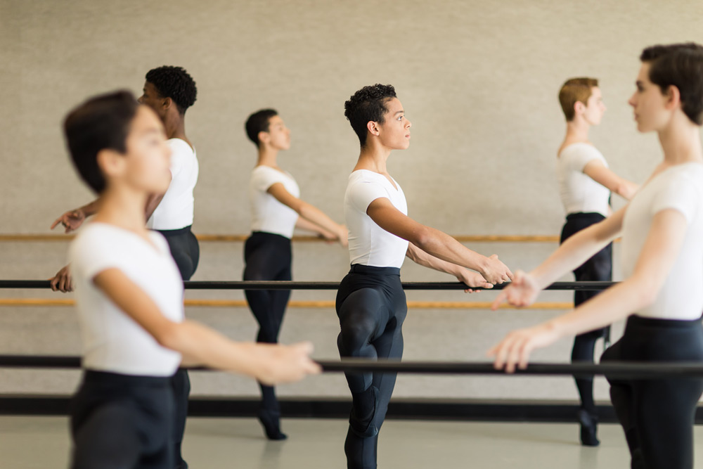 Ballet Dancer Poses At Grunge Wall, Dancing Studio Stock